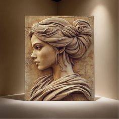 a sculpture of a woman's head with braids in her hair is on display