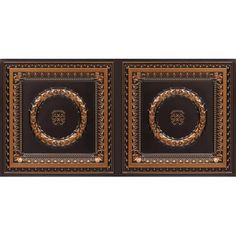 two black and gold wall hangings with an ornate design on the front, one has a