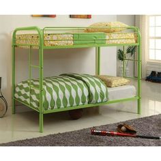 a green metal bunk bed sitting in a bedroom