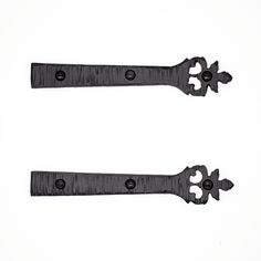 two black iron handles on white background