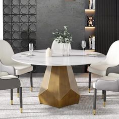 a dining room table with white chairs around it