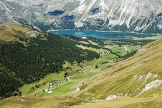 an aerial view of the mountains and lakes