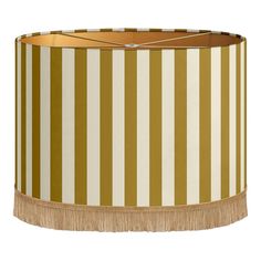 a lampshade with stripes and fringes on it