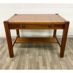 a wooden table with two drawers on it