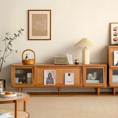 a living room filled with furniture and pictures on the wall