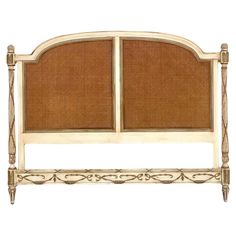 the headboard is made from wood and has an intricate design on it's sides