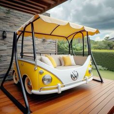 a yellow and white vw bus swing bed