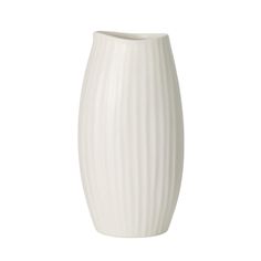 a white vase sitting on top of a table