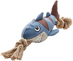 a stuffed shark toy hanging from a rope