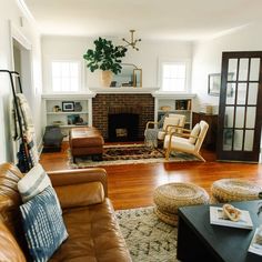 a living room filled with furniture and a fire place