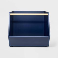 a blue planter with a gold handle on the top and bottom, in front of a white background