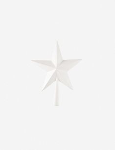 a white paper star hanging from the ceiling