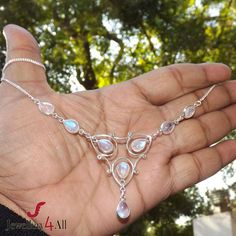 "925 Sterling Silver with Natural Fire Rainbow Moonstone Bezel Set Handmade Party Wear Necklace. Main Color: Blue Fire        Size: Adjustable (17.5\" + 1.5\" inch with Extender) Stone Size (can vary as per availability) : 6x9 Pear       Weight: 11.3gram  Item code: ADBB104 Metal - Solid 925 Sterling Silver This beautiful piece is made with Solid 925 Sterling Silver and Natural Gemstone. It is handmade and hand polished. We make multiple pieces in each style and choose gemstones with highest qua Beaded Foot Jewelry, Solid Silver Bracelets, Dainty Pendant Necklace, Bezel Jewelry, Rainbow Moonstone Necklace, Floating Necklace, Rainbow Moonstone Pendant, Rainbow Necklace, Blue Rainbow