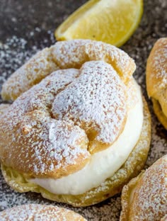 lemon filled pastries with powdered sugar on top