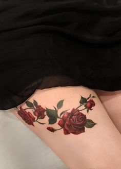 a woman's thigh with roses on it