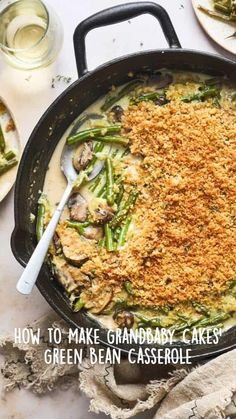 a skillet filled with green bean casserole and topped with crumbs