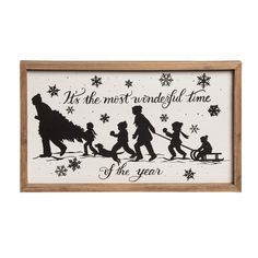 a wooden framed sign with silhouettes of people and snowflakes