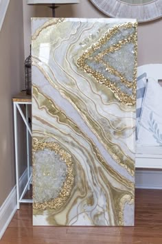 a white and gold marble wall in a living room