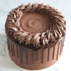 there is a chocolate cake with icing on it