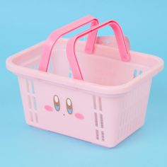 a pink shopping basket with two handles and eyes on the side, against a blue background