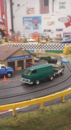 toy cars and trucks on a model track