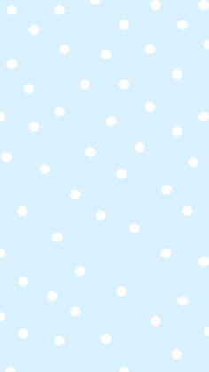 a blue background with white polka dots