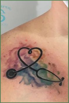 a stethoscope tattoo on the back of a man's shoulder and chest