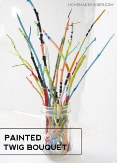 a vase filled with lots of colorful sticks