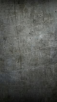 an old metal surface with scratches and rivets