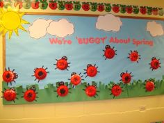 a bulletin board with ladybugs on it in a classroom setting at the elementary school