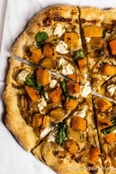 a pizza sitting on top of a white table