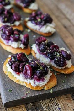 small cranberry and goat cheese appetizers on a wooden board