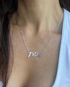 COLOR: SILVER PLATED AND GOLD PLATED MATERIAL: STAINLESS STEEL The Officially Mrs necklace - the perfect way to celebrate your new status as a Mrs! This elegant and understated necklace features a single pendant with the initials "Mrs" in a delicate and stylish font. Crafted with love, the Officially Mrs necklace is the perfect accessory for your wedding day, bridal shower, or as a special gift for the newlywed in your life. The necklace is available in both gold and silver-plated options, ensur Mrs Necklace, New Status, Stylish Fonts, Special Gift, Timeless Pieces, Perfect Match, Special Gifts, Silver Plate, With Love