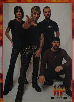 a group of men standing next to each other in front of a white background with an orange border