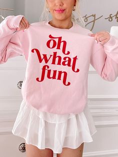 Our Oh What Fun Crewneck is a light pink crew neck with a soft fleece lining on the inside of the sweatshirt. "Oh What Fun" is written in red on the front side. fit : True to size, model wearing a size small Christmas Sweatshirt Ideas, Sassy Shortcake, Fancy Fits, Oh What Fun, Preppy Christmas, Wallet Minimalist, Christmas Crewneck, Mens Wallet, Pink Crewneck