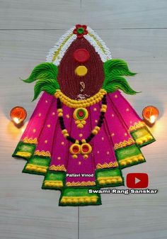 an intricately decorated idol hanging from the ceiling