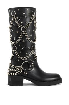 **FINAL SALE - NO EXCHANGES OR RETURNS** The Fillmore-Black Flat Boot is an edgy yet versatile addition to any wardrobe. These black biker boots feature a subtle block heel for comfort and style, while the chain draping and silver stud accents add a touch of rocker-chic to the silhouette. Shaft Height: 12.5" Opening Circumference: 14" Heel Height: 2" Biker Chic Fashion, Rocker Boots, Black Biker Boots, Boots 2024, Black Flat Boots, Platform Combat Boots, 2024 Wishlist, Luxury Designer Shoes, Azalea Wang