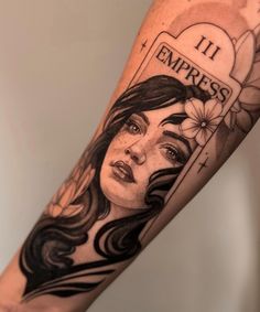 a woman's arm with a tattoo on it that reads 11 1 empress