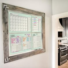 a kitchen wall with a calendar hanging on it