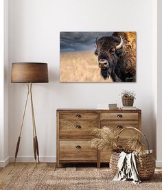 a bison standing in the middle of a room with a basket and lamp on it