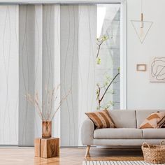 a living room with white walls and wooden floors