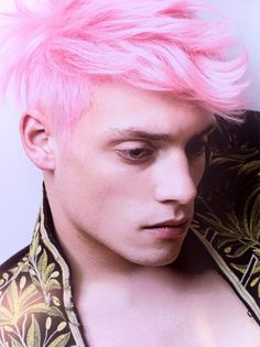 a man with pink hair wearing a shirt