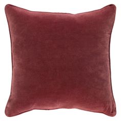 the burgundy velvet pillow is shown on a white background