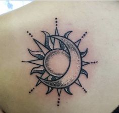 a sun and moon tattoo on the back of a woman's upper arm,