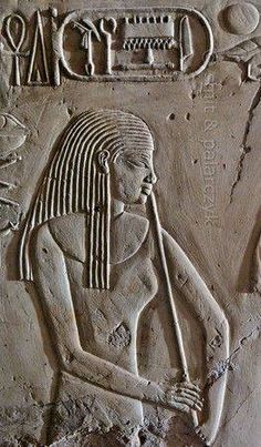 an ancient egyptian relief depicting the god osirie