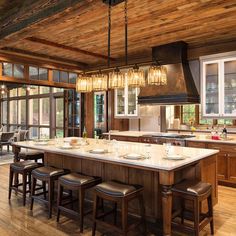 a large kitchen with an island and lots of counter space