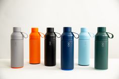 thermos are lined up in different colors