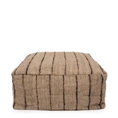 a brown and black striped poufce on a white background, with the lid closed