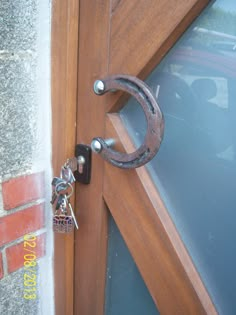 a door handle is attached to a wooden door