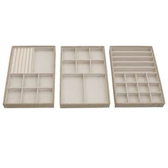 three empty trays with dividers on each side and one open drawer in the middle